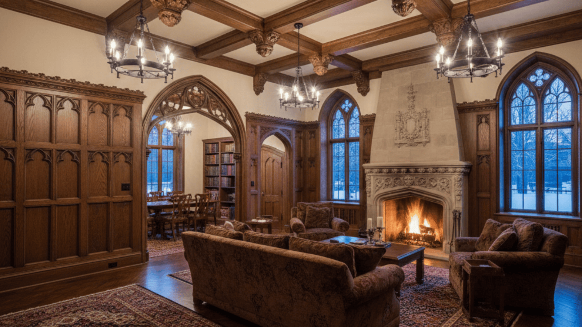 A-cozy-living-room-featuring a fireplace and elegant wood paneling on the wall .