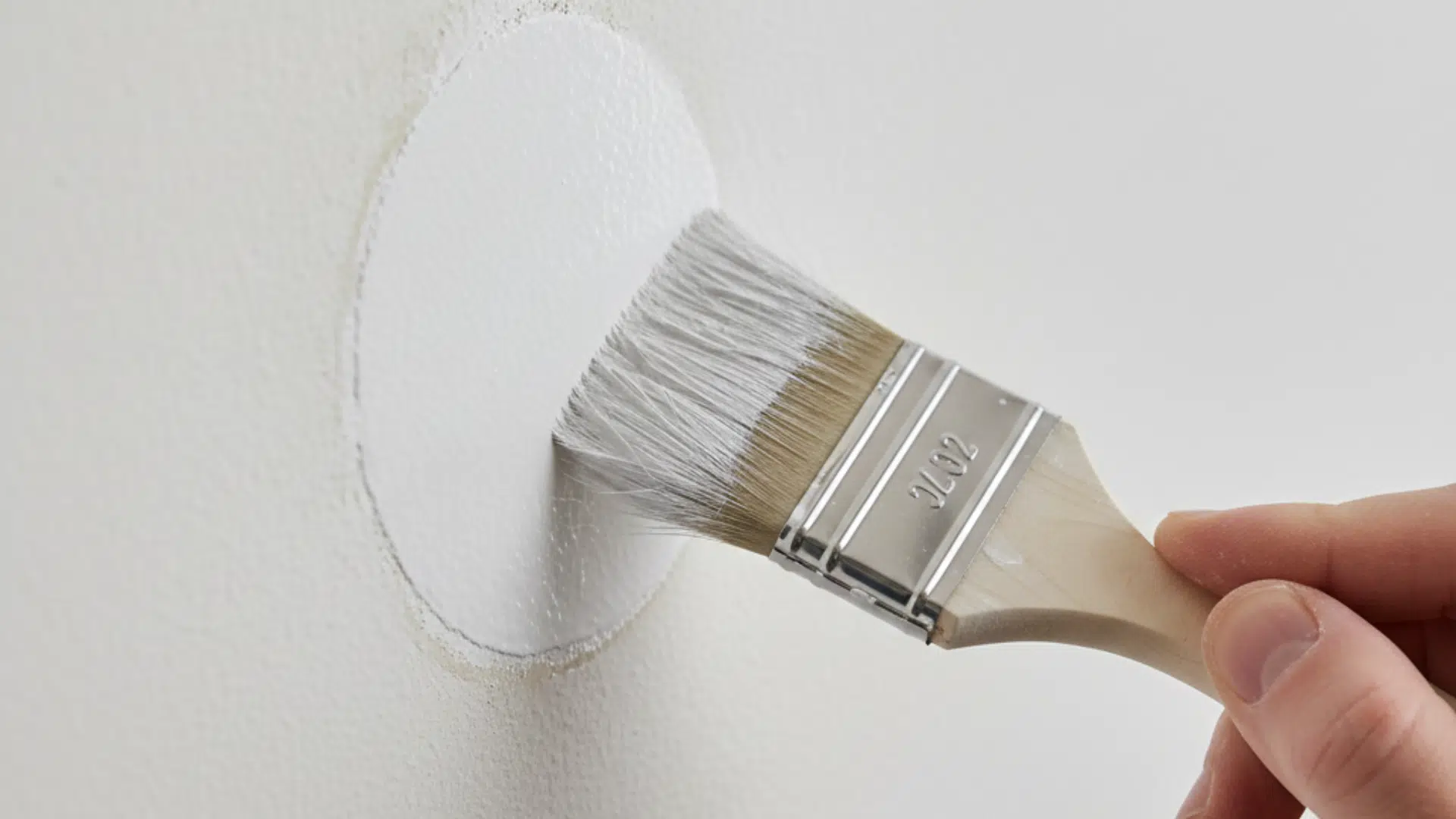 Applying primer to the repaired area