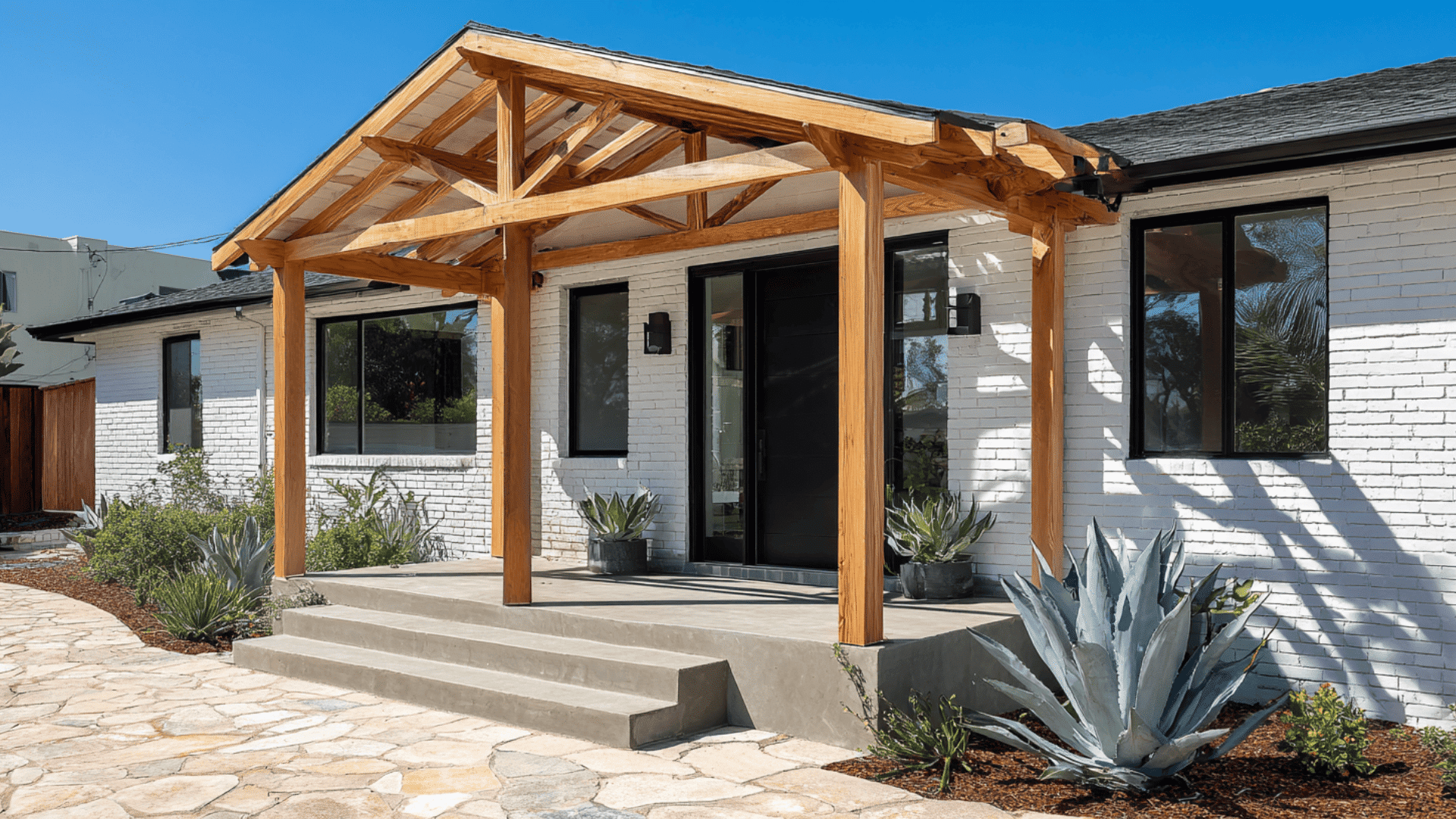 Painted Brick White Black Trim and a Light Wood Pergola