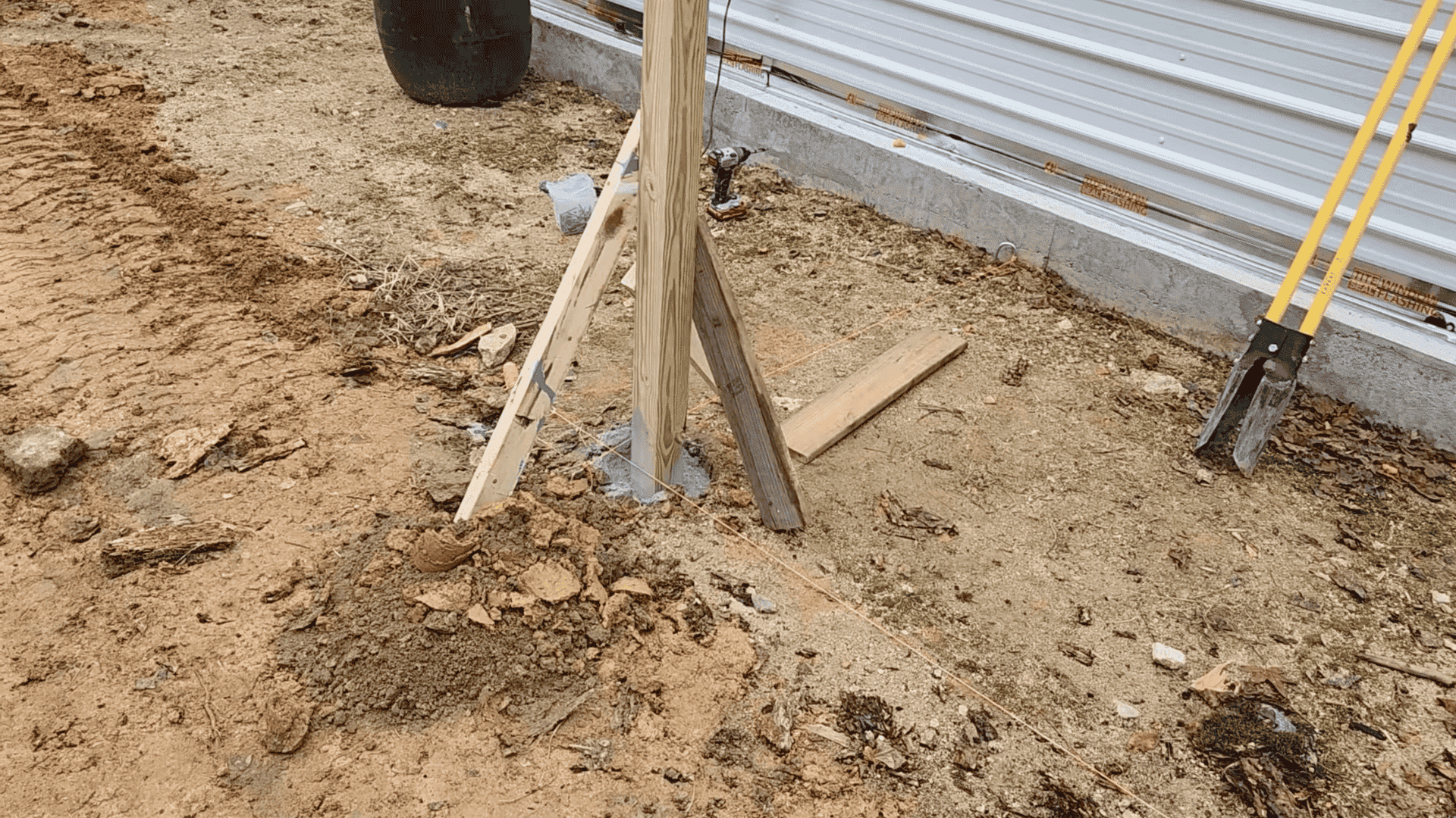 step 3 set posts in concrete and add the front beam