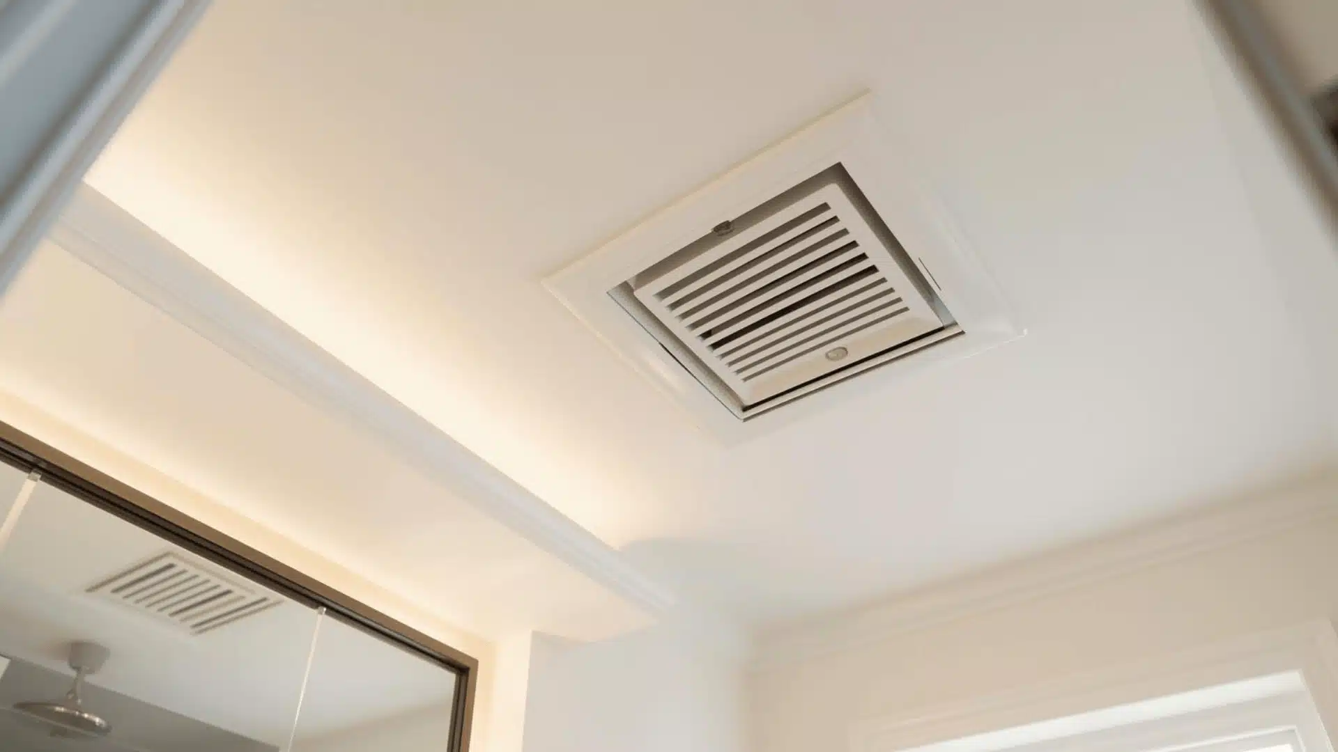 Fresh white vent cover blends into half bath ceiling.