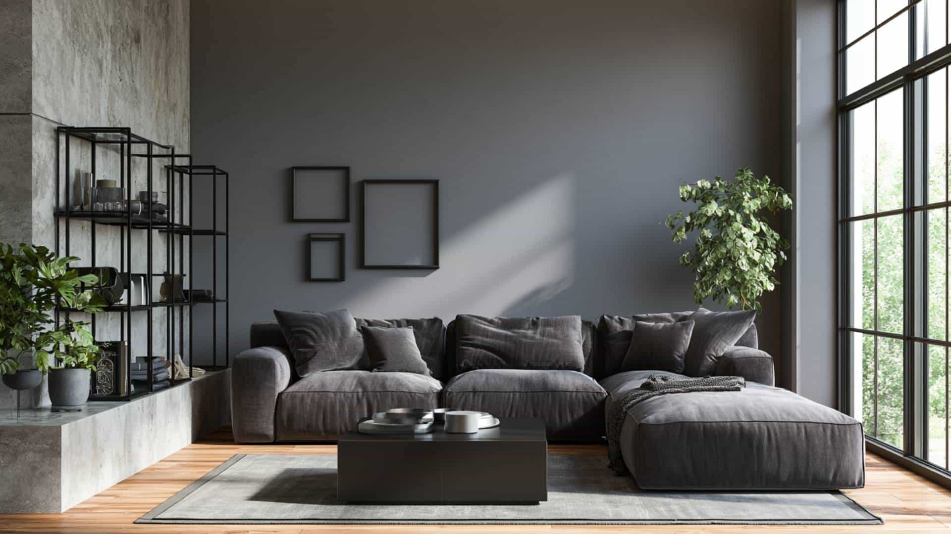 Modern living room with black accent wall, charcoal sectional, and industrial-inspired minimalist decor.
