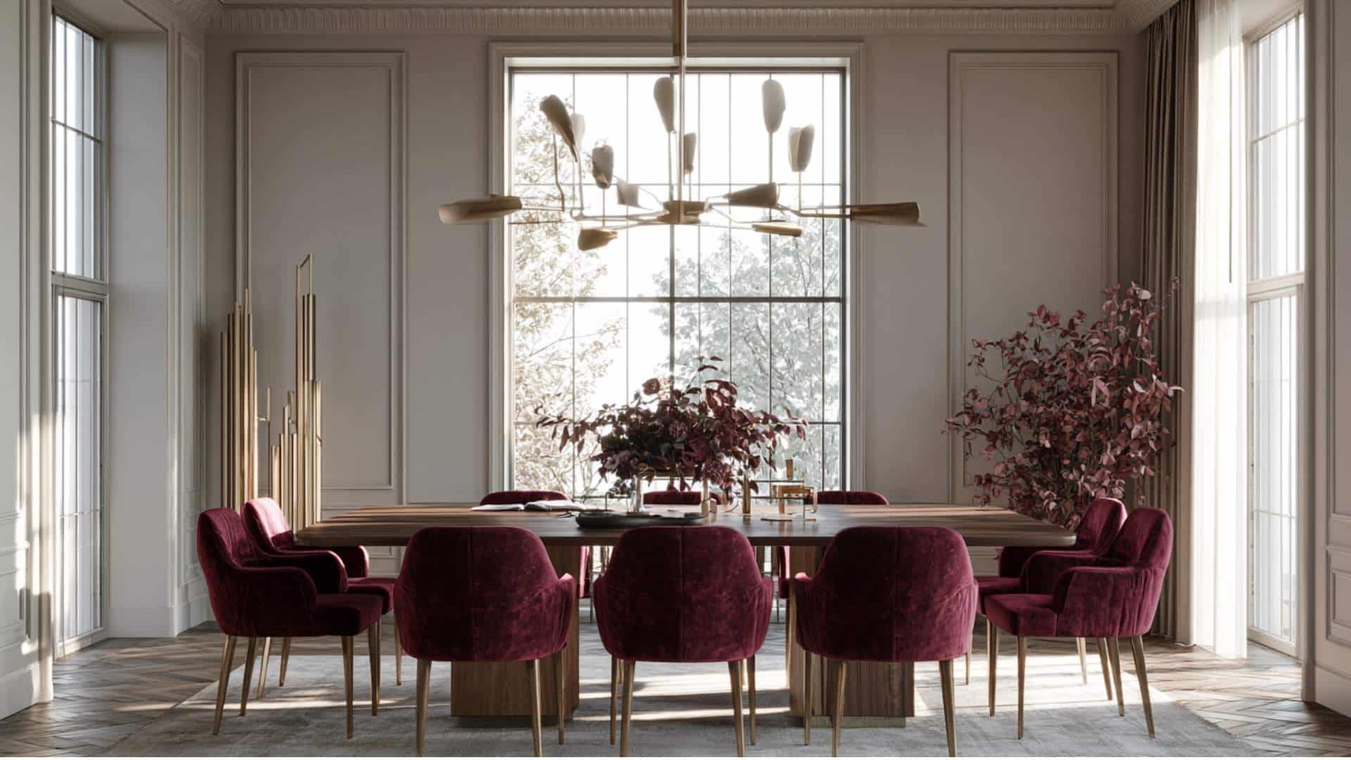 Gray living room with burgundy velvet chairs and décor, elegant warm tones and soft lighting.
