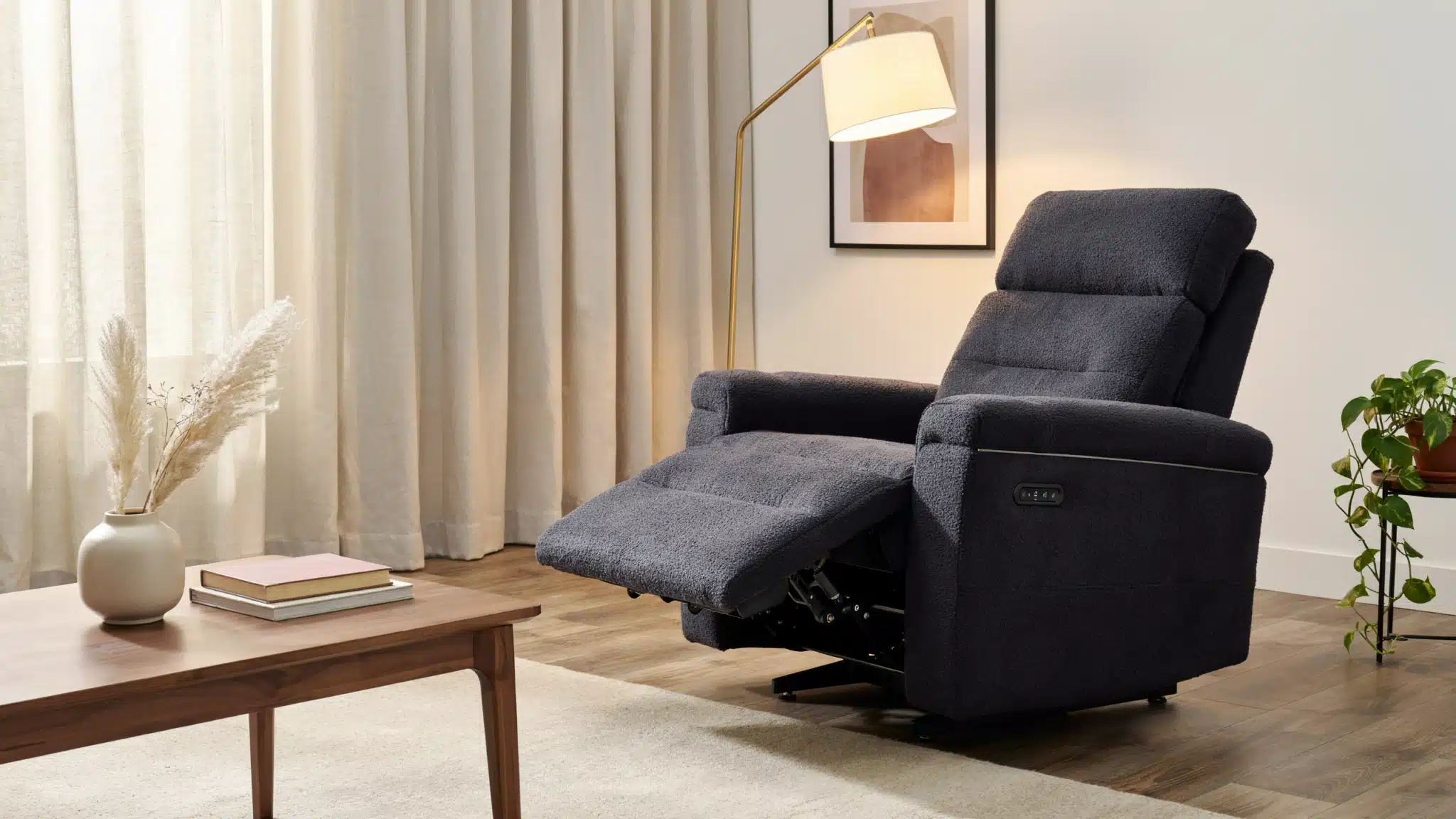 Power recliner chair with motorized buttons and remote in modern living room fully extended footrest