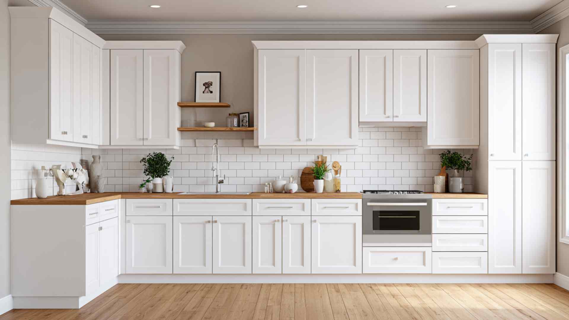 White shaker kitchen cabinets with clean recessed panels in bright modern farmhouse style kitchen interior