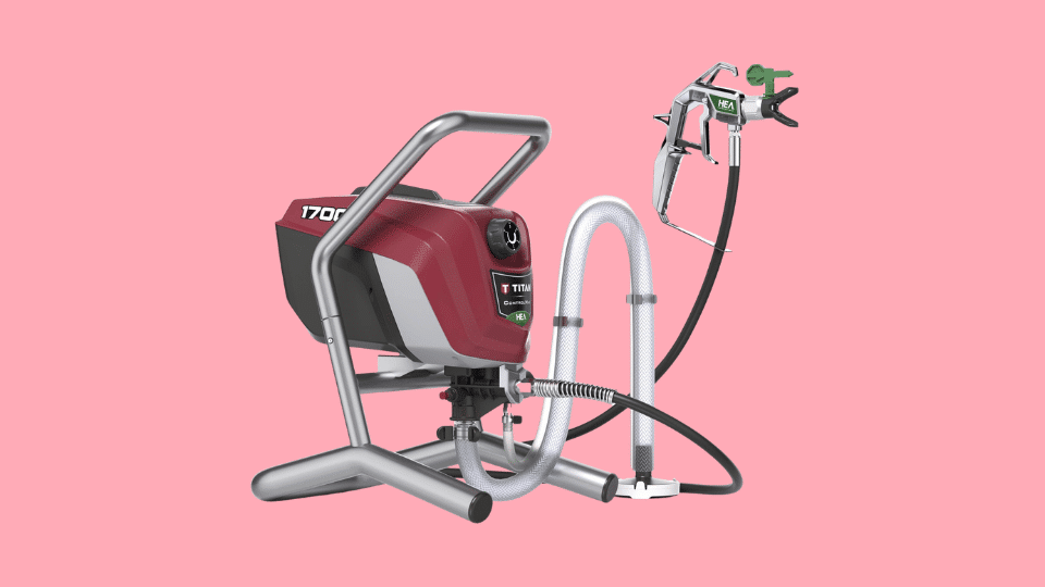 Titan Tool Control Max 1700 Pro airless paint sprayer on stand with hose and spray gun against a pink background.