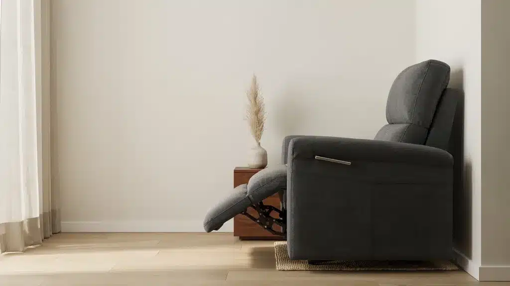 Wall hugger recliner chair in compact room sliding forward design close to wall space saving furnish.